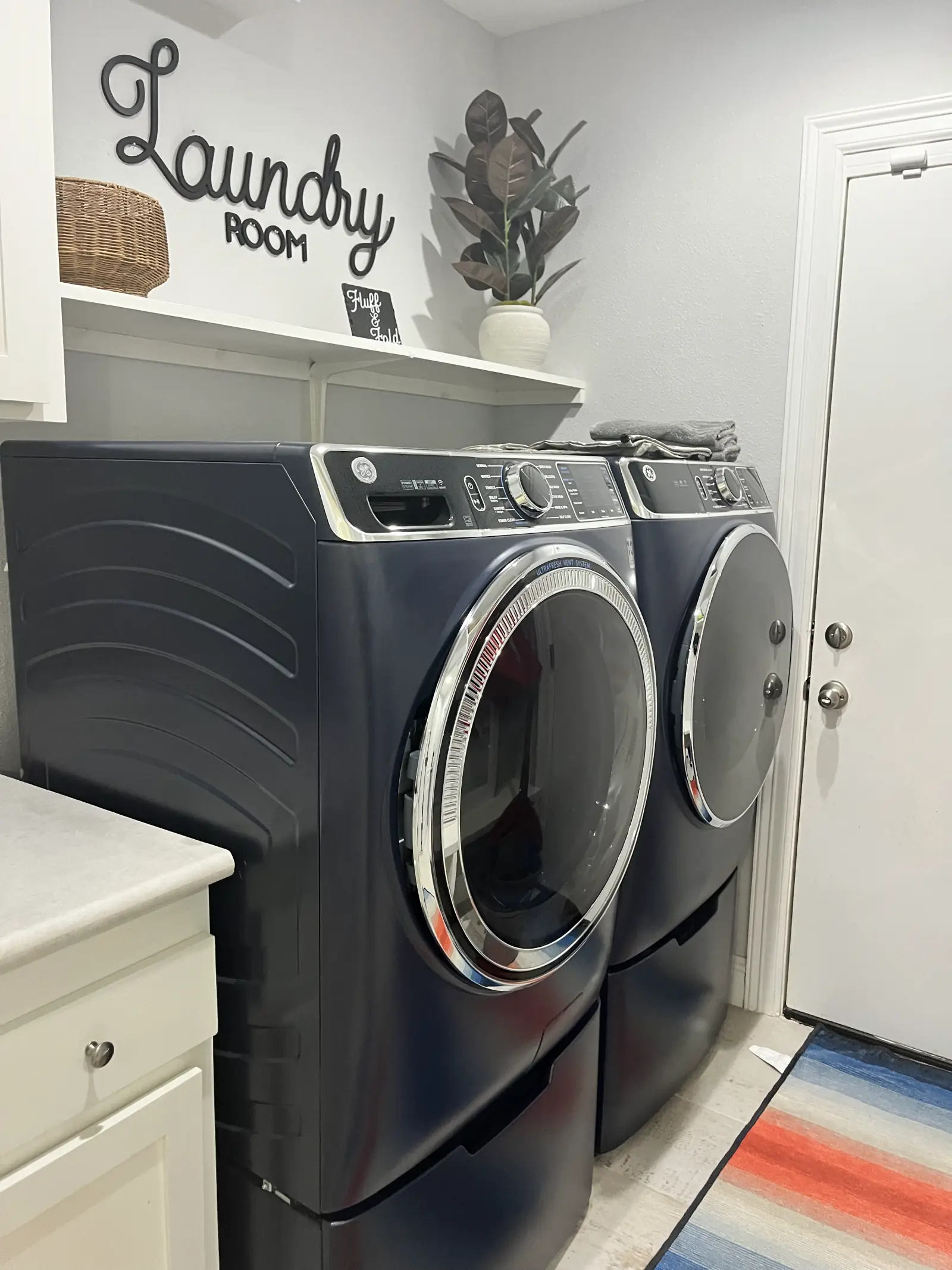 Laundry room with washer and dryer detailed